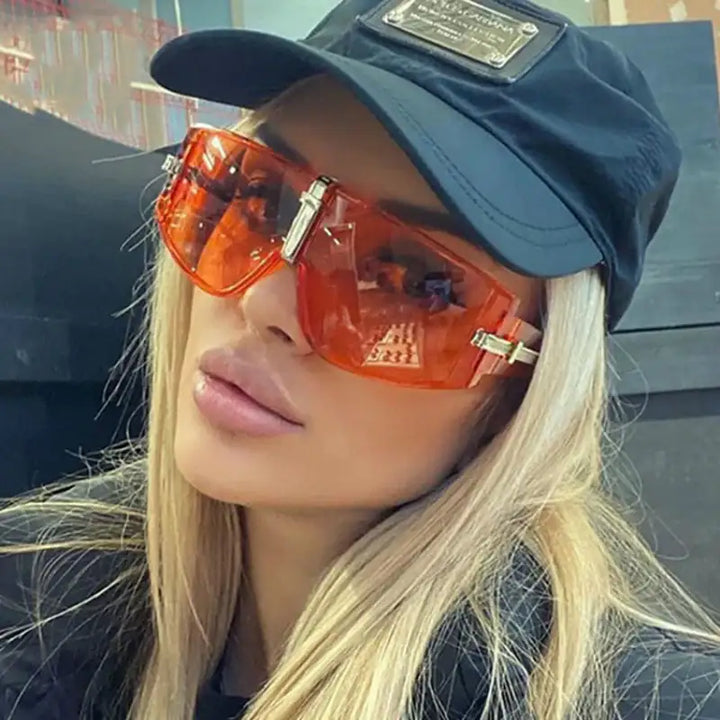 Orange Sonnenbrille mit schwarzer Kappe, Damenmode bei IsabellBoutique030